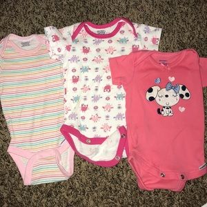 3 pink onesies